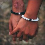 man and woman bracelet pose